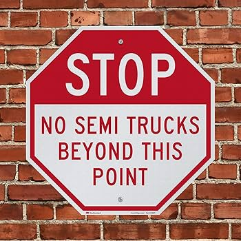 No Trucks Beyond This Point Sign