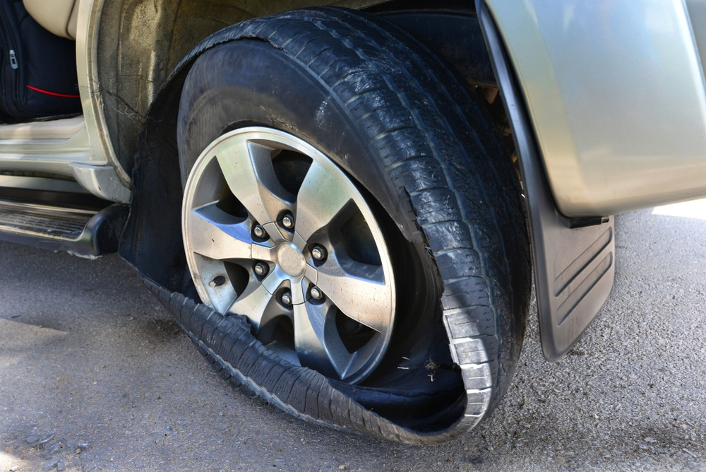Truck Tire Blowout Hit My Car – What to Do, Legal Steps, and Safety Tips